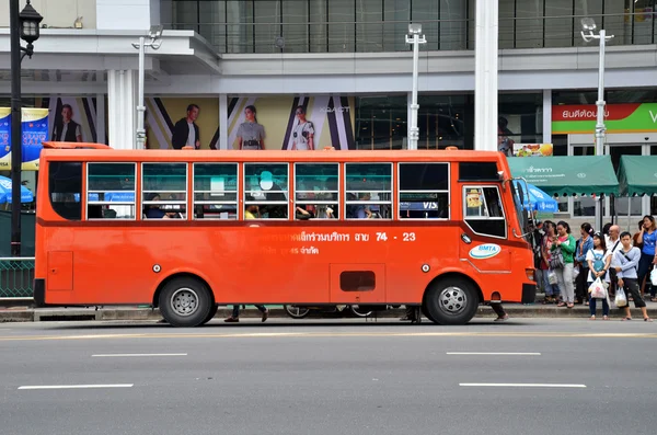 Unidentified passengers waits for public bus in Bangkok