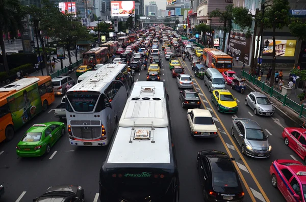 Traffic moves slowly along a busy road in Bangkok, Thailand