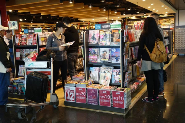 Customers shop for books on 23 Novemer 2014 in Hong Kong Airport