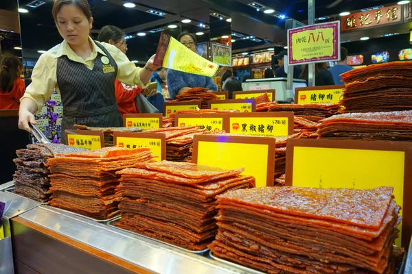 Shop-keeper sells assortment of Chinese preserved meat in Macau