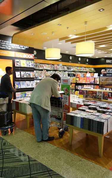 Customers shop for books in Changi Airport