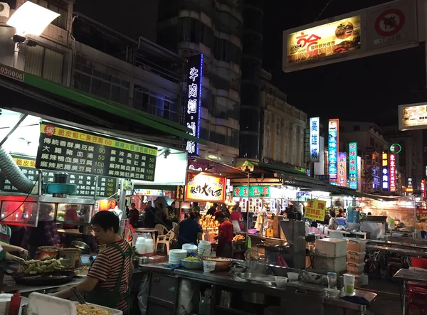 Pedestrians shopping at  Fengjia Night Market