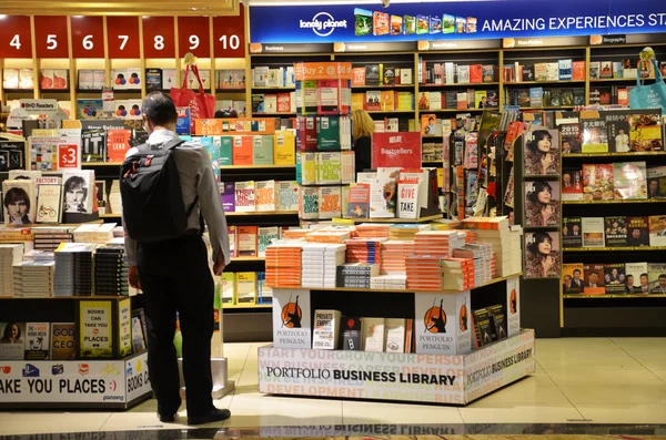 Customers shop for books in Changi Airport