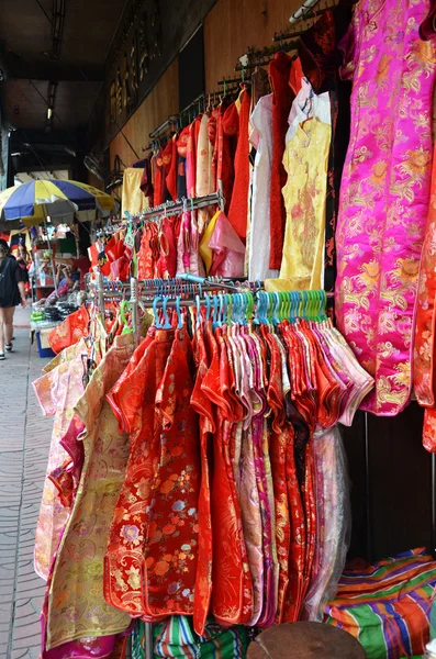 Stall sells Chinese New Year clothing on the street