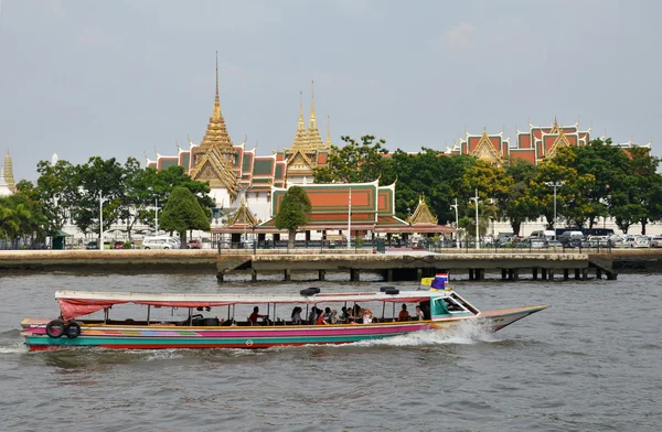 The tourists get on boat for sightseeing along Chao Phraya River