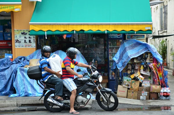 Unidentified people shop at a grocery shop in Little India, Sing