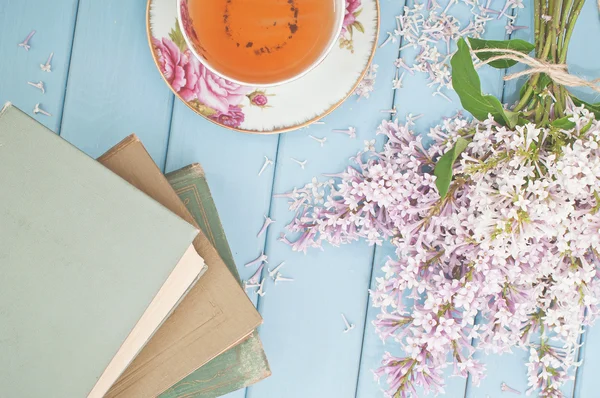 Tea. books and flowers