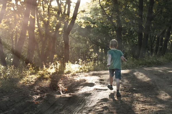 Boy running away