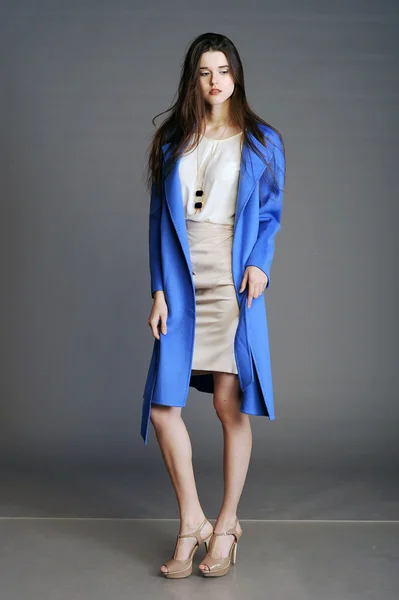 Beautiful girl  in blue coat