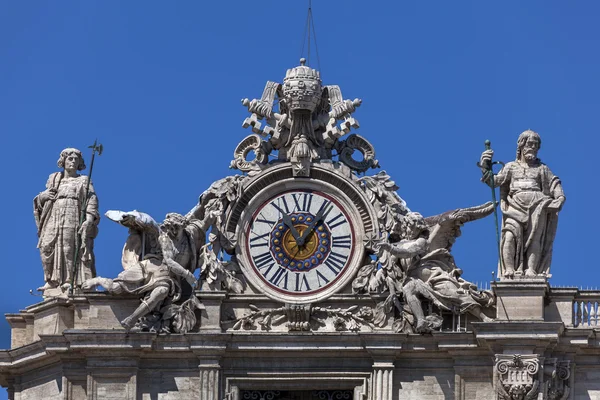 Clock on the St. Peter's facade in Rome, Italy