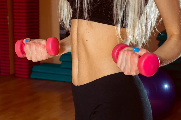 Woman doing exercises in the gym