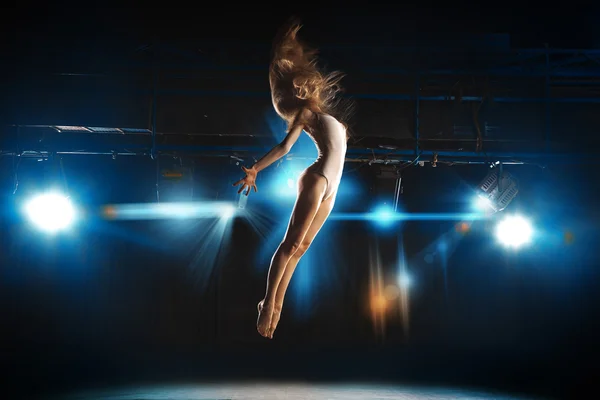 Ballet dancer fly on stage in theater