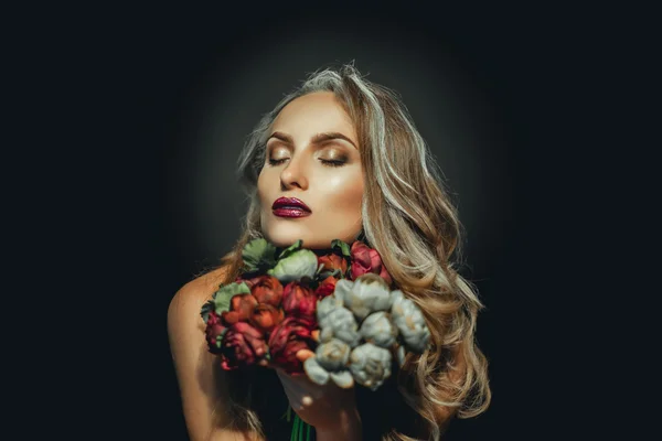 Portrait of attractive grey hair woman with flowers