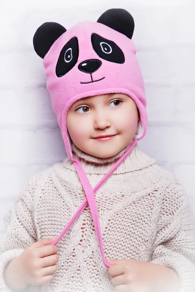 Smiling girl in warm hat