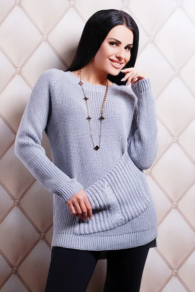 Brunette woman in knitted sweater