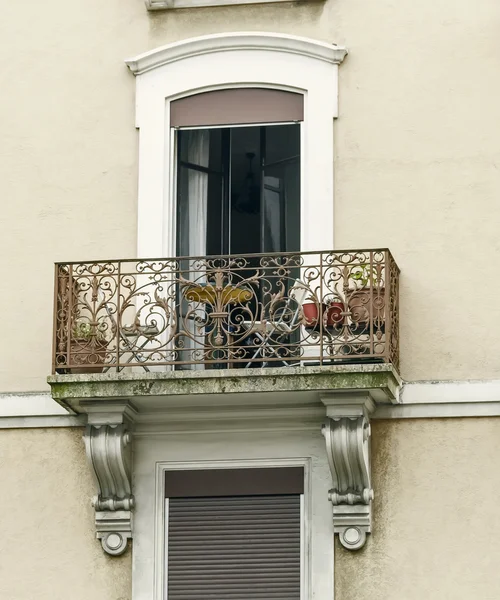 Openwork balconies on the facade of the house