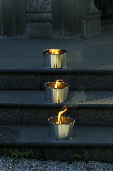 Lighted candles on steps