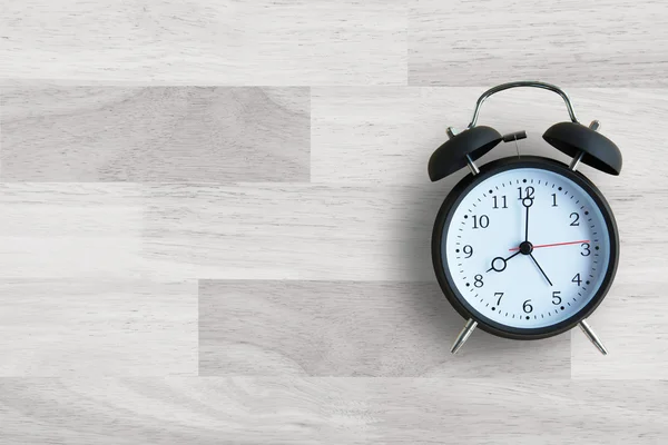 Alarm clock with wooden floor