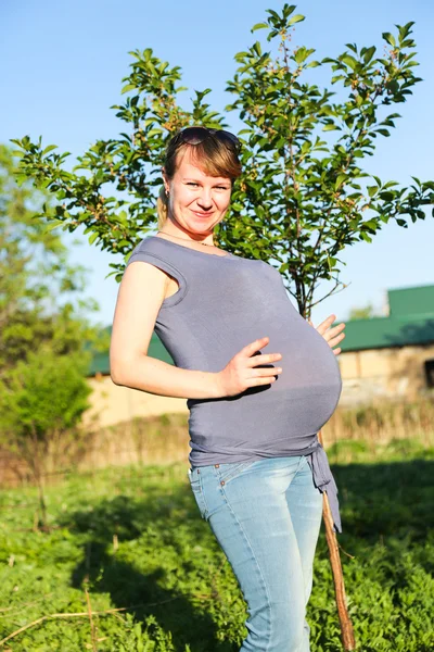 Pregnant woman on nature