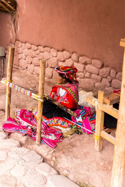 Woman sell hand crafts  in Peru.