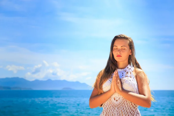 Girl closed eyes in yoga asana