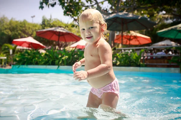Small blonde girl in pool