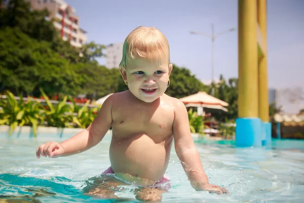 Small blonde girl in pool