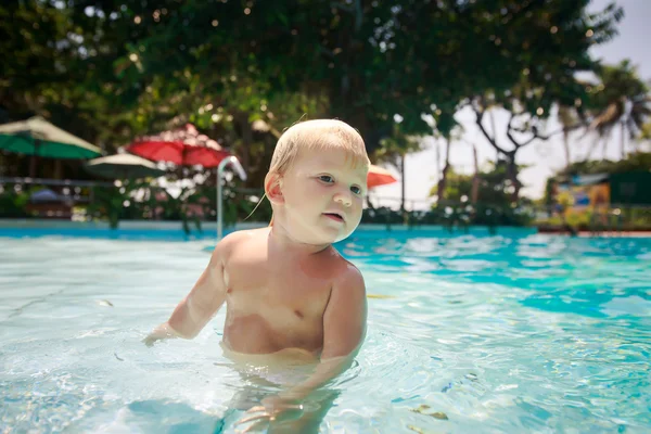 Small blonde girl in pool