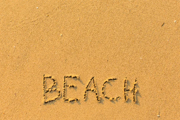 Beach - word hand-written on sand