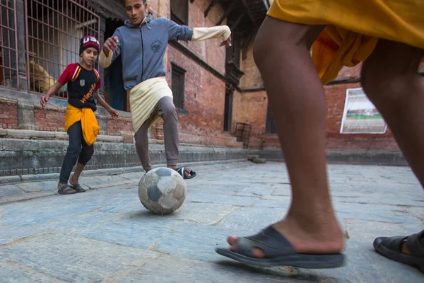 Unknown children play football
