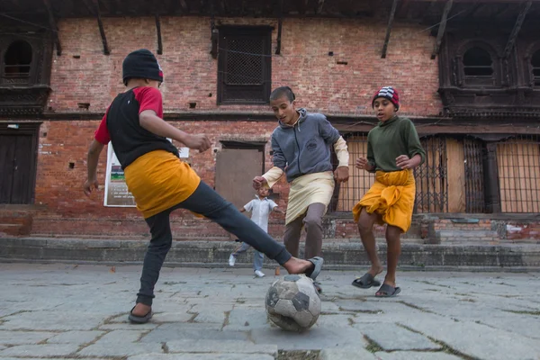 Children play football