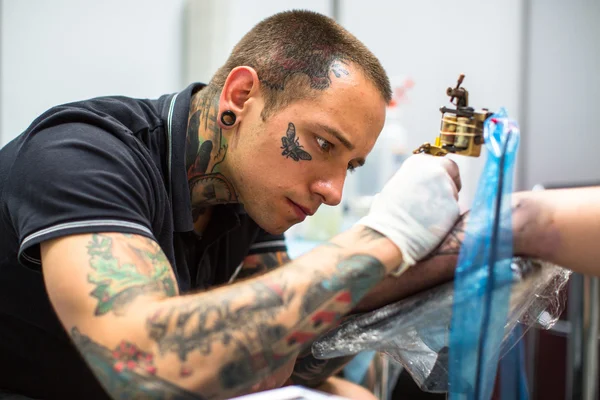 People make tattoos at International Convention