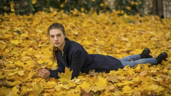 Girl lying on the leaves