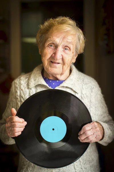 Elderly woman with vinyl