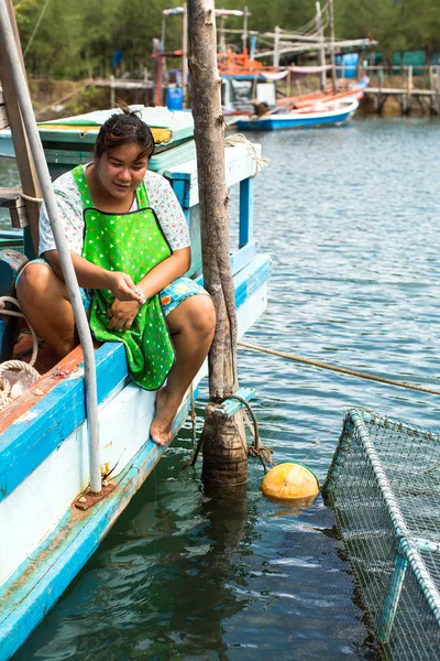Unidentified local woman in fisherman\'s village