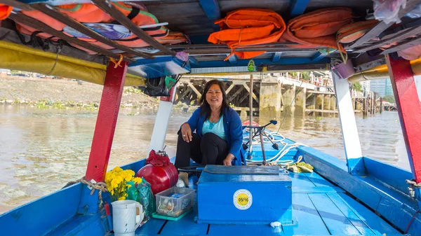 Woman drives a boat, Vietnam