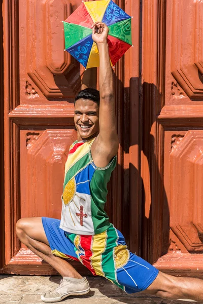 Brazilian man dancing Frevo in Olinda