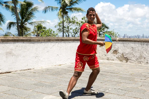 Brazilian man dancing Frevo in Olinda