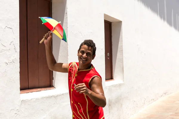 Brazilian man dancing Frevo in Olinda