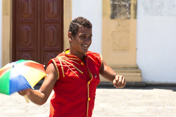 Brazilian man dancing Frevo in Olinda