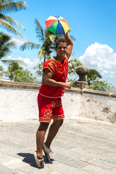 Brazilian man dancing Frevo in Olinda