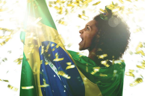 woman holding the brazilian flag