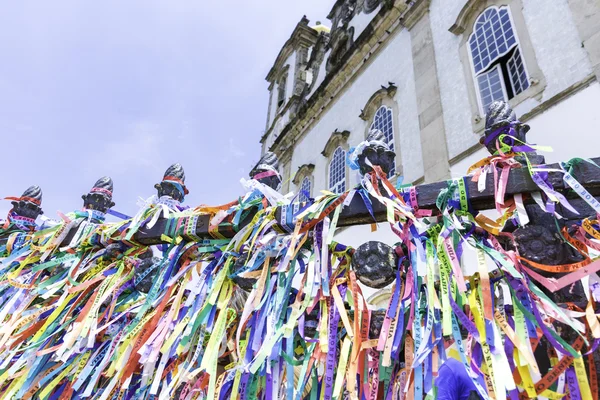 Wall of wish ribbons blowing in the wind at the famous Igreja Nosso Senhor do Bonfim da Bahia church in Salvador Bahia, Brazil.
