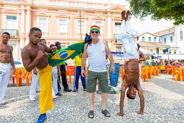 BAHIA, BRAZIL - CIRCA NOV 2014: A group of people playing Capoeira. Capoeira is a Brazilian martial art that combines elements of dance, acrobatics and music, and is sometimes referred to as a game.