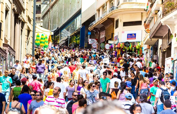 SAO PAULO, BRAZIL - CIRCA DEZ 2014: Hundreds of People walk along the 25 March area in Sao Paulo, Brazil. 25 March is a popular commerce region near the center of Sao Paulo, Brazil.