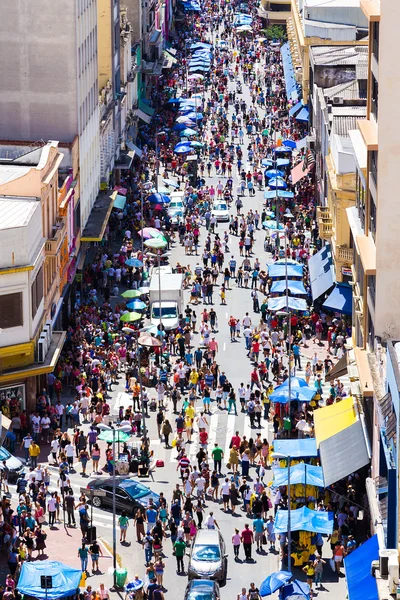 SAO PAULO, BRAZIL - CIRCA DEZ 2014: Hundreds of People walk along the 25 March area in Sao Paulo, Brazil. 25 March is a popular commerce region near the center of Sao Paulo, Brazil.