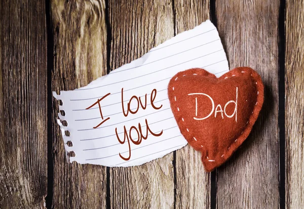 I Love You Dad on paper and a heart