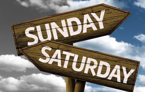 Sunday x Saturday On wooden sign