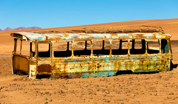 Abandoned bus in the desert