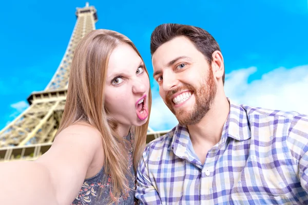 Beautiful Couple taking a selfie photo in Paris, France